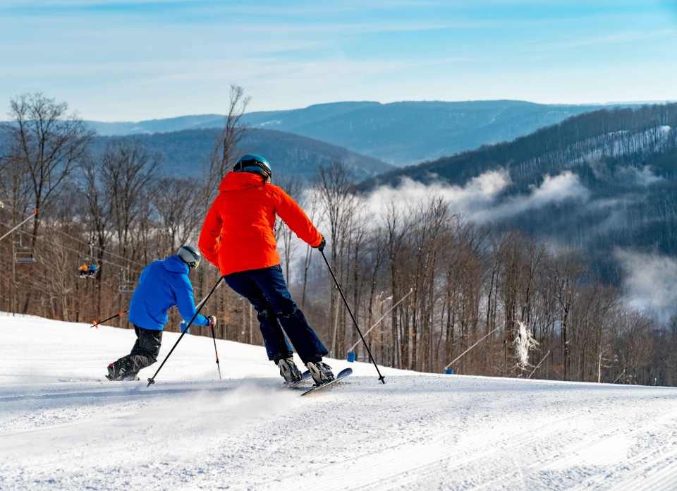 Skiers coming down the hill at Holiday Valley Resort