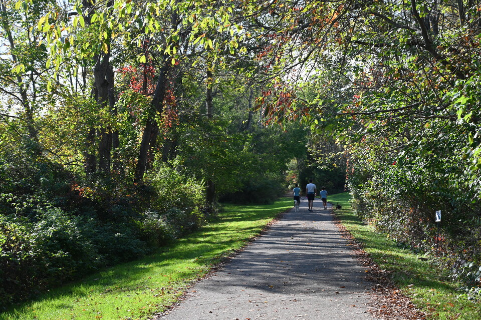 Family and their dog enjoying an early fall day on Allegheny River Valley Trail