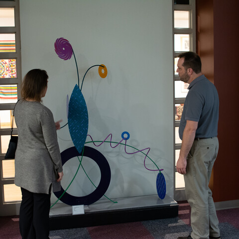 Visitors viewing art at Regina A. Quick Center