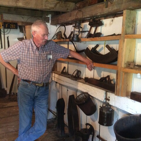 Guy showcasing historic material at Ruth Howe-Prescott House