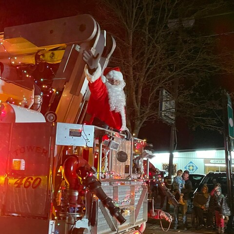 Santa waving during parade in Randolph